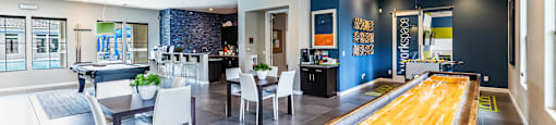 a game room with a pool table and a bar at CHANDLER APARTMENT HOMES, Las Vegas, NV, 89139