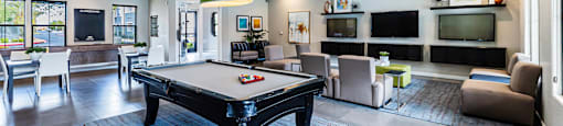 a clubhouse with a pool table and a tv at CHANDLER APARTMENT HOMES, Las Vegas, Nevada