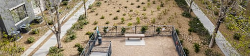 an aerial view of a courtyard with benches and trees at CHANDLER APARTMENT HOMES, Las Vegas, NV