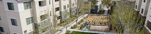 an aerial view of an apartment complex with a yard and green grass at CHANDLER APARTMENT HOMES, Las Vegas, 89139