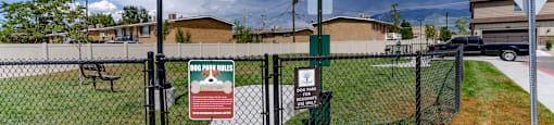 a fenced in area with a sign on a chain link fence at Arcadia Townhomes, Roy, 84067