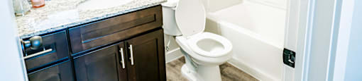 a bathroom with a toilet and a sink at Arcadia Townhomes, Utah, 84067