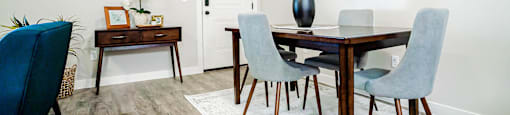 a dining room with a table and chairs at Arcadia Townhomes, Roy, 84067
