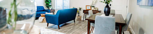 a living room and dining room with a table and chairs at Arcadia Townhomes, Utah, 84067