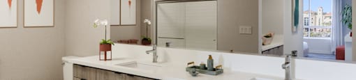 A bathroom with a toilet, sink, and mirror.