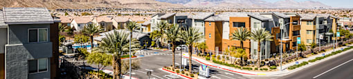 A sunny day in a residential area with a clear blue sky.