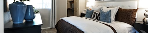 Bedroom with window and closet at THE PARKSIDE VILLAS APARTMENT HOMES, Las Vegas, Nevada