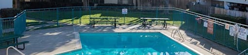 Gated Pool Surrounded by Picnic Tables at The Edge on the Boulevard, Fremont, CA