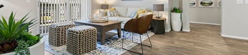 a living room with furniture and a ceiling fan at Ascent Apartments, Cottonwood Heights Utah