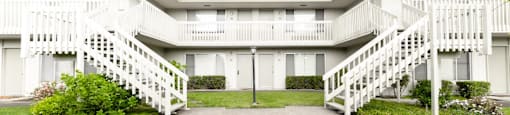 Building exterior with a beautiful lawn near the sidewalk at OTAVON APARTMENTS, California
