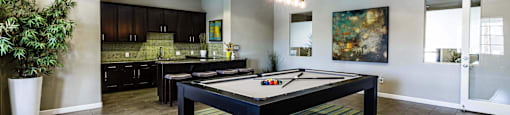 play a game of pool in our games room at EVERETT APARTMENT HOMES, Las Vegas, NV