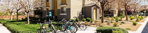 A group of bikes at Everett parked in front of a building. at EVERETT APARTMENT HOMES, Las Vegas, NV, 89113