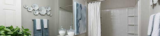 Bathroom vanity and shower at THE PARKSIDE VILLAS APARTMENT HOMES, Las Vegas, NV, 89123