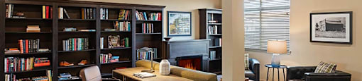 Desk area by bookshelves at TRADITIONS AT LAFAYETTE Apartments, Colorado, 80026