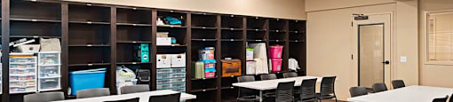 Large room with tables and shelves at TRADITIONS AT LAFAYETTE Apartments, LAFAYETTE , CO 80026