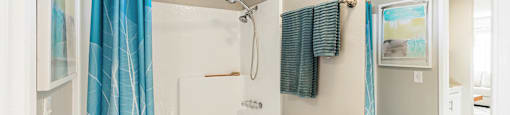 a bathroom with a shower and a sink and a toilet at SERRANO HIGHLANDS APARTMENT HOMES, Lake Forest, CA, 92630-7006