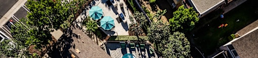 a view of the pool from above  the pool is surrounded at SERRANO HIGHLANDS APARTMENT HOMES, Lake Forest, California