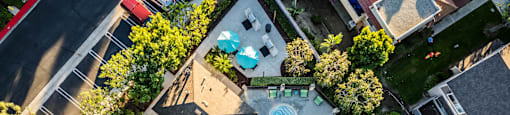 a birds eye view of the pool and backyard of a house at SERRANO HIGHLANDS APARTMENT HOMES, Lake Forest, California