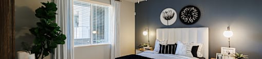a bedroom with a bed and a ceiling fan at SYNC APARTMENT HOMES, North Las Vegas Nevada