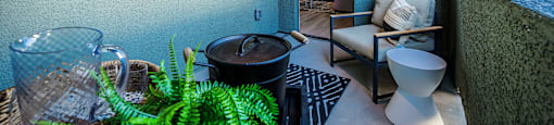 a balcony with a chair and a toilet and a plant at SYNC APARTMENT HOMES, North Las Vegas, NV 89084