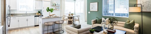 an open living room with a kitchen and a dining room at SYNC APARTMENT HOMES, North Las Vegas
