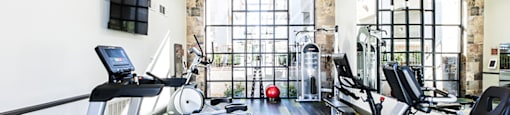 Fitness room with cardio and strength equipment at THE CLUBS AT RHODES RANCH APARTMENT HOMES, Las Vegas, NV