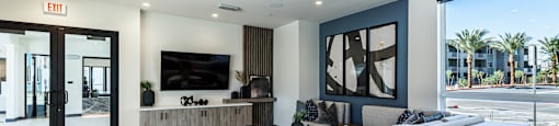a large living room with a bar and a television at BASE APARTMENT HOMES, LAS VEGAS, 89166