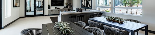 a dining room and living room with a table and chairs at BASE APARTMENT HOMES, LAS VEGAS, NV