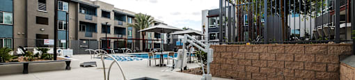 a resort style pool is next to an apartment building at BASE APARTMENT HOMES, Nevada
