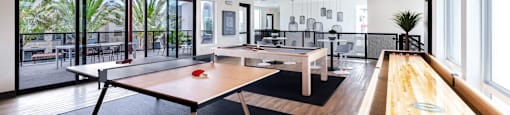 a game room with ping pong tables and a pool table at BASE APARTMENT HOMES, LAS VEGAS, NV