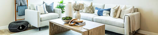 a living room with a white couch and a coffee table at BASE APARTMENT HOMES, LAS VEGAS, NV 89166