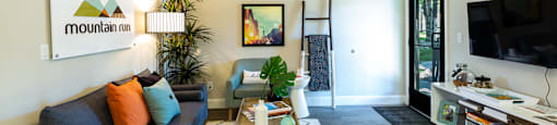 a living room with a couch and a coffee table at Mountain Run Apartments, Orem, UT 