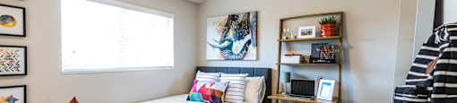 a bedroom with a bed and a desk with a chair at Mountain Run Apartments, Utah
