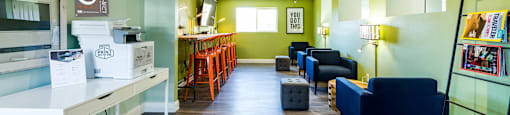 a living room with green walls and blue and yellow furniture at Mountain Run Apartments, Orem, Utah, 84058
