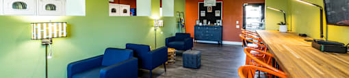 a room with a bar and chairs and a table at Mountain Run Apartments, UT, 84058