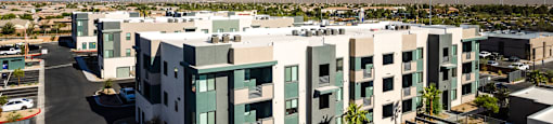 a view of a building with mountains in the background