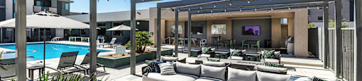 a rendering of a patio with couches and chairs and a pool