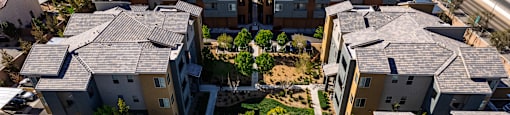 A bird's eye view of a neighborhood with houses and trees.