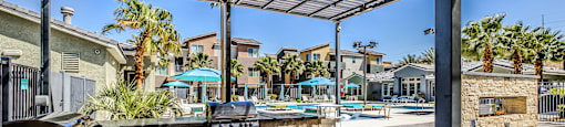 A sunny day at the outdoor grill area with tables and chairs.