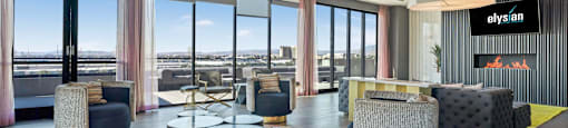 A modern living room with a view of the city.
