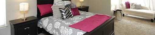 a bedroom with a bed and two night stands