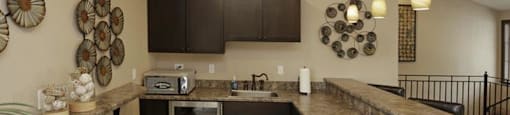 a kitchen with a counter top and a sink