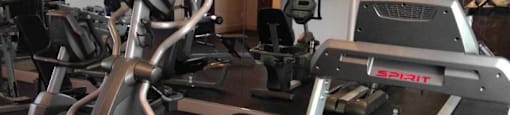 a room filled with lots of different types of exercise equipment