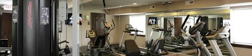 a room filled with lots of different types of exercise equipment
