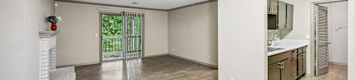 A spacious room with light wood flooring and white walls.