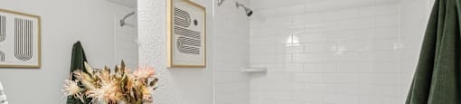A bathroom with a white sink and a white toilet.