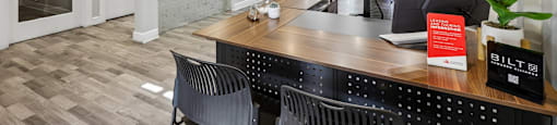 A reception area with a desk and chairs.