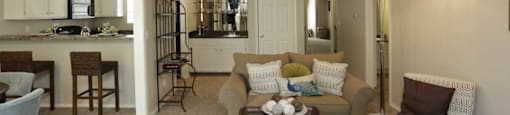 a living room with a couch a chair and a table
