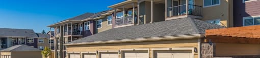 Apartments for Rent in Tigard OR - Sygnii - Parking Garages and Building Exterior with Private Balconies