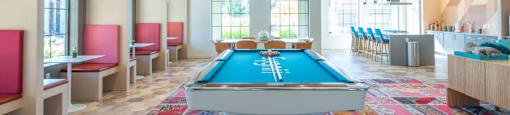 Apartments in Tigard, OR - Sygnii - Clubhouse with a Billards Table, Full Kitchen, and Multiple Types of Seating